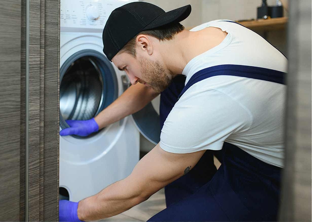 AppFix technician repairing a washing machine